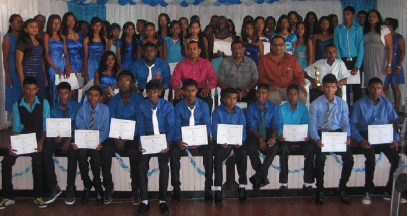 The first batch of Class of 2014 pose with officials after receiving their certificates