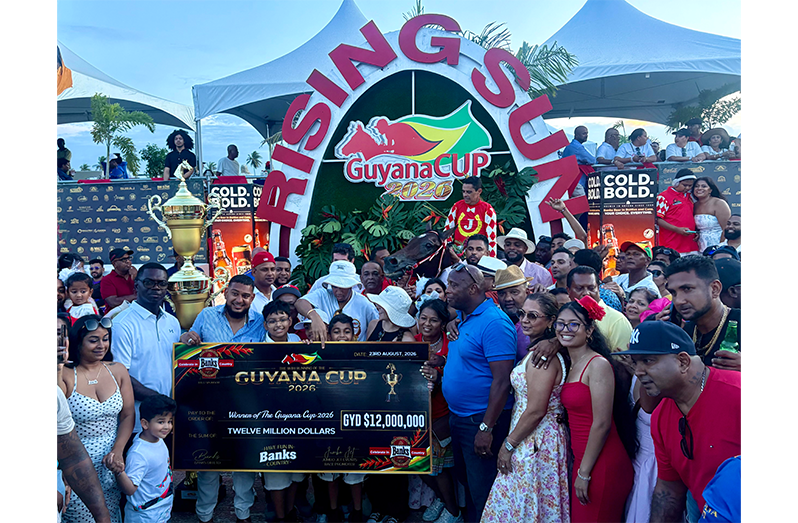 Minister Charles Ramson, and winning officials in the winner’s circle with
Guyana Cup winner SandPipes