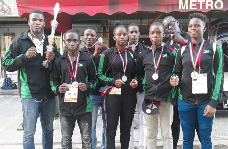 Eight of the nine medal winners in Trinidad yesterday afternoon.