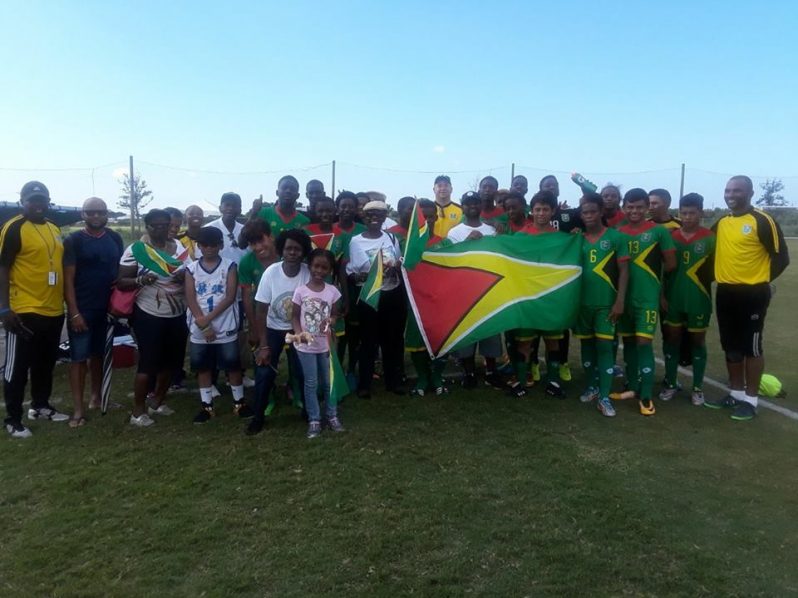 Team Guyana and their supporters following their 1-0 win over St Lucia yesterday in the CONCACAF U-15 Championship.