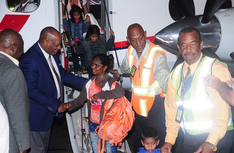 Minister of State Joseph Harmon welcoming the evacuees upon their arrival at the Eugene F. Correia International Airport at
Ogle (Photo by Delano Williams)
