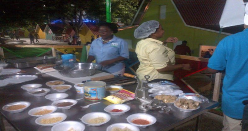 PHOTO CAPTION: The culinary arts team hard at work on Thursday last, during the cooking demonstration at the Grand Market in Haiti