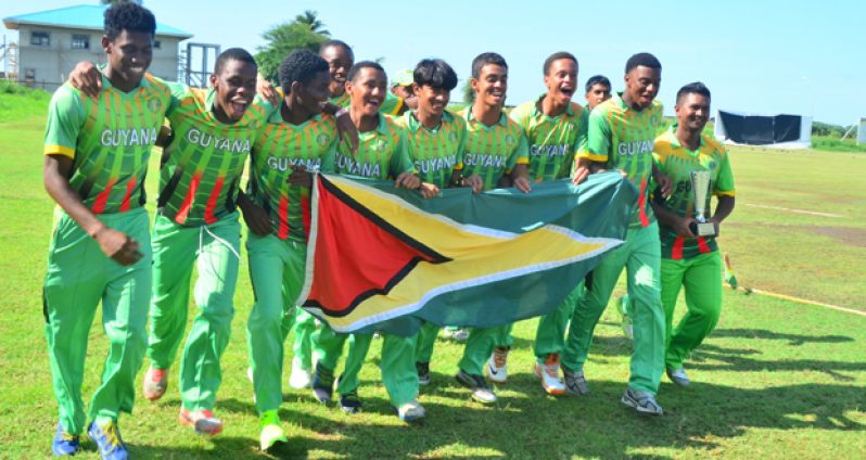 We are the champions! The victorious Guyana Under-19 team completes a short jog with the Golden Arrowhead, while skipper Brian Sattaur safely grasp the West Indies Cricket Board Regional Under-19 50 overs trophy. (Photo by Adrian Narine)