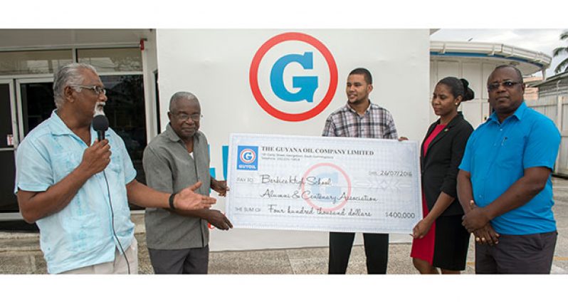 BHS alum, Grantley Waldrond (second left) accepts the cheque from Guyoil Finance Controller, Rosalind Franklin. With them are Guyoil mangers Eric Whaul (right) and Reggie Bhagwandin (Photo by Samuel Maughn)