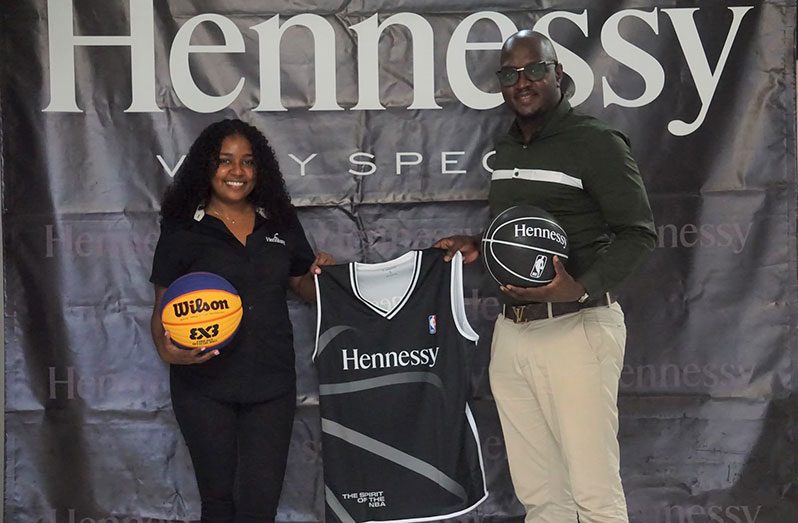 Atina Samad, Hennessy - Moet and Wines Manager (R), and Rawle Toney during a simple presentation at Ansa McAl’s East Coast Demerara headquarters