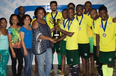 The New GT&T Indoor Champs Hikers are presented with their Championship trophy by Public Relations Officer Allison Parker.