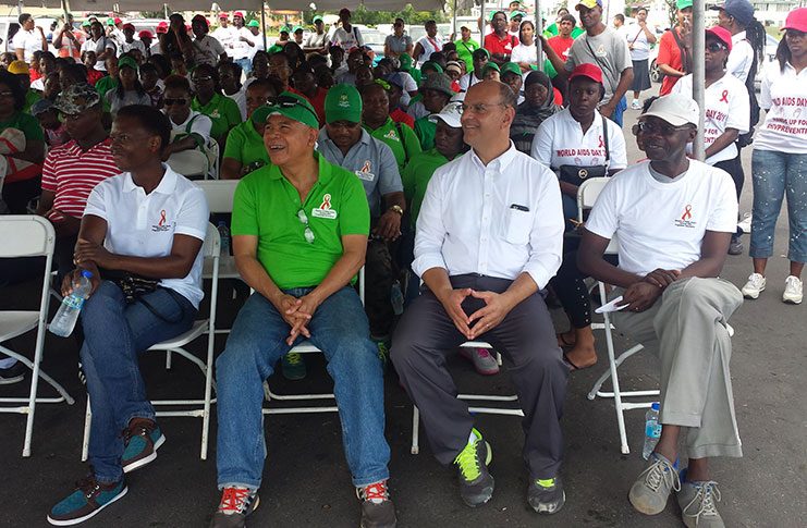 From left in front row:  NAPS Programme Director  Dr. Rhonda Moore; Minister of Public Health Dr. George Norton; U.S. Embassy Representative Mr. Albert Razick; and UNAIDS Country Representative (Guyana and Suriname) Dr. Martin Odiit at the World AIDS Day Rally at Durban Park