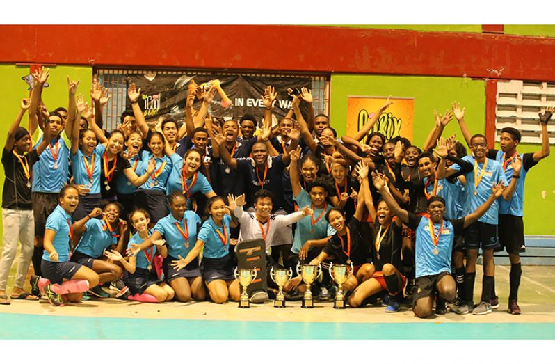 Overall winners of the GHB Indoor Hockey Championships pose with their accolades. (Royston Alkins photo)