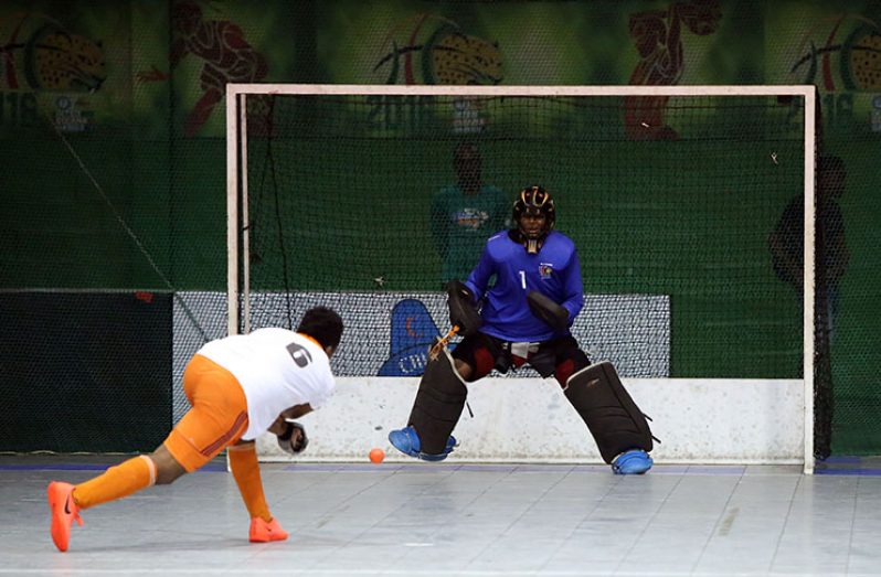 Kevin Spencer scores a penalty stroke against goalkeeper Paul D’Andrade of Supernova.