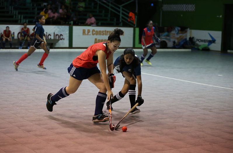 GBTI GCC Tigers striker Gabriella Xavier attacks Kezia Chinian of Saints.