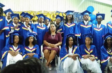 The 2018 graduation class of the Howell Wilson Primary and teacher Yvonne Nazier