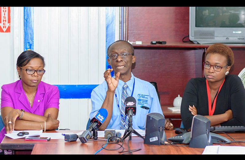 PAHO/WHO Country Representative, Dr. William Adu-Krow, detailing facts about cervical cancer and the importance of HPV vaccines in the presence of  MCH Director, Dr. Ertenisa Hamilton on his right and the DCMO, Dr. Karen Boyle, on his left. (Photo by Delano Williams)
