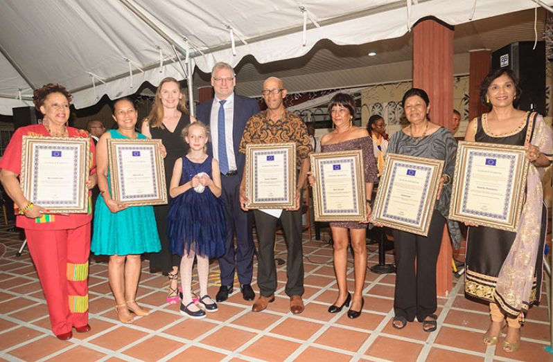 Human Rights awardees take a photo with the European Union Ambassador, (fifth from left); his wife, Ruta Drizyte-Videti (third from left); his daughter, Celeste Videti (fourth from left); and awardees (from left) Margaret Lawrence, Riane de Haas-Bledoeg, Denis Chabrol, Halima Khan, Ameena Gafoor and  Saroj Rambarran.  (Photo by Delano Williams)
HRA EU: The European Union Ambassador, Jernej Videti, delivers opening remarks (Photo by Delano Williams)