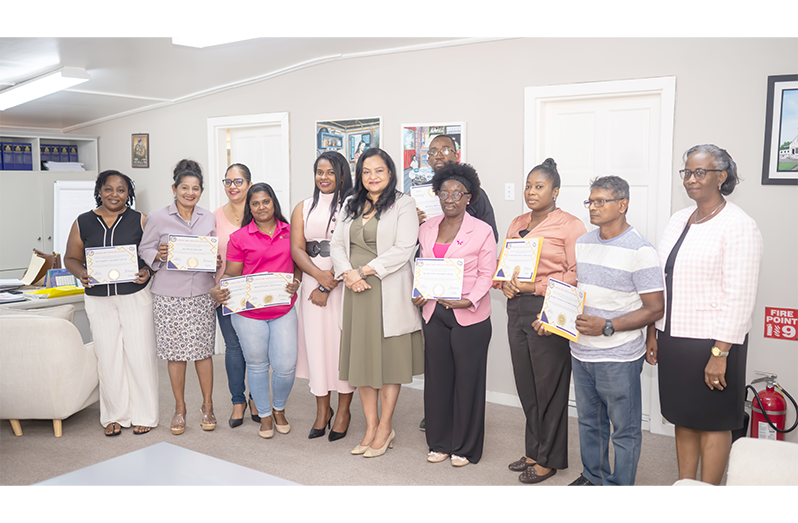 Minister of Human Services and Social Security, Dr. Vindhya Persaud (centre), and Permanent Secretary, Dr. Erica Forte pose with representatives of children’s homes who were awarded Childcare Services Licences