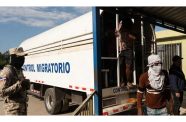 Haitian migrants in a lorry belonging to the immigration enforcement service of the Dominican Republic after being transported to Haiti