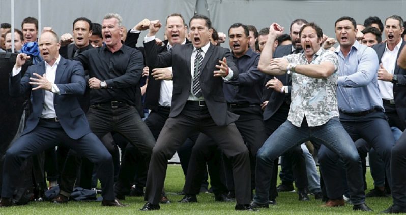 Former and present All Blacks perform a haka as Jonah Lomu’s casket is carried out of Eden Park. (Reuters)