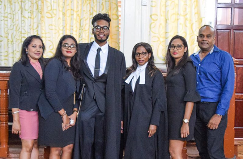 Centre - Saeed Hamid and Justice Simone Morris Ramlall, posing with Hamid’s relatives