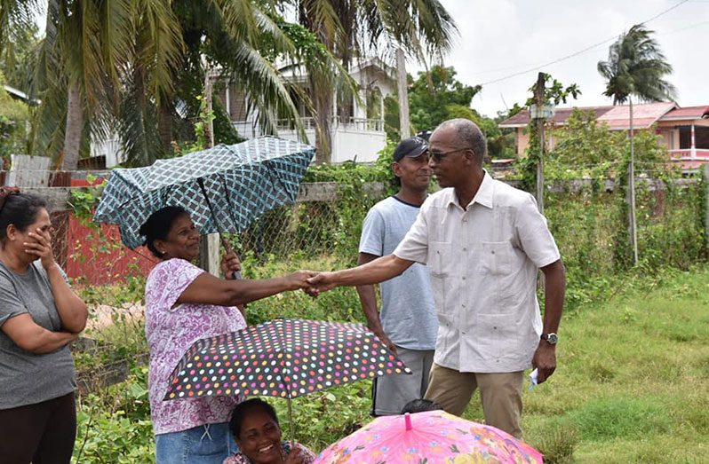 Minister of Labour, Joseph Hamilton interacting with residents of Region Six