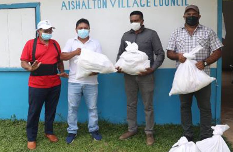 Minister of Local Government and Regional Development, Nigel Dharamlall, along with Region Nine Chairman, Brian Allicock; Aishalton’s Toshao, Michael Thomas and another representative of the village