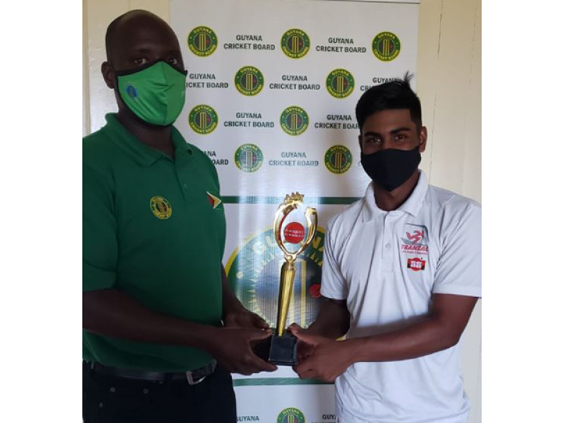 Player-of-the-match Mathew Nandu collects his trophy from Colin Stuart.