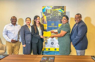 Royal international hotel’s Zheng Sai li Handing Over Cheque to Nareeza Latif from the Petra Organisation alongside official Petra and Royal International Hotel (Japheth Savory Photo)