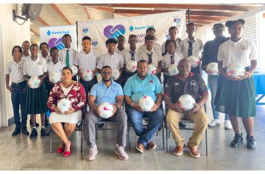 Officials and students at the ball-distribution exercise for the RBL Schools Football League (Japhet Savory photo)