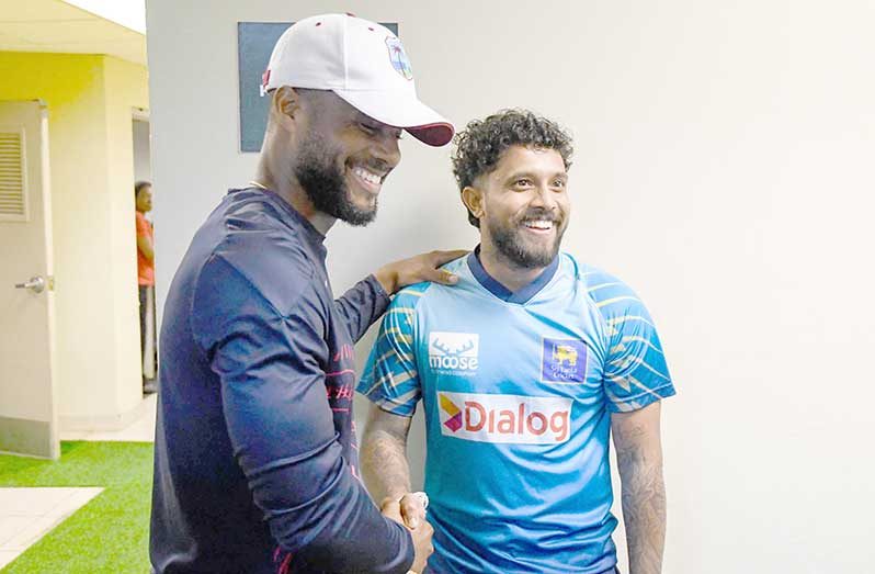 West Indies Captain Shai Hope (left) and Sri Lanka Skipper Kusal Mendis share a laugh during the third and final ODI on Monday, which was abandoned without a ball being bowled (Photo courtesy Randy Brooks/Getty Images).