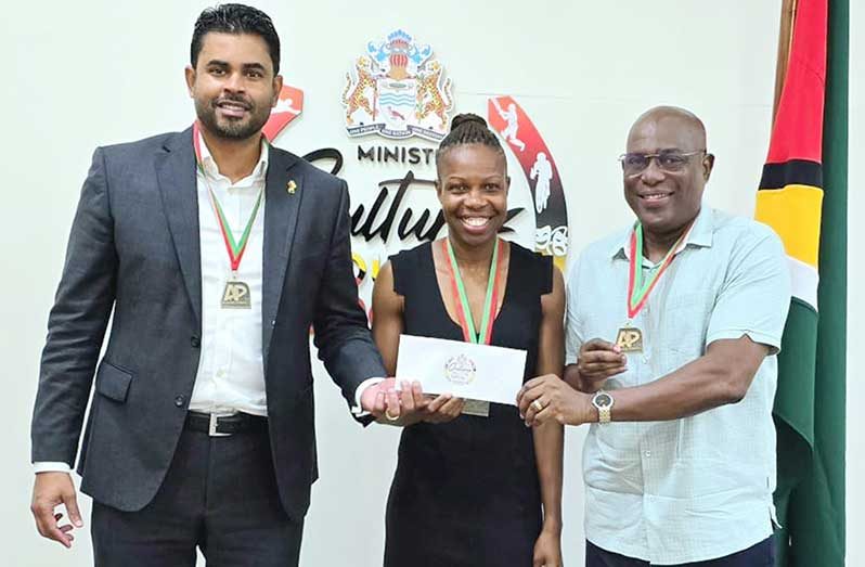 Minister Charles Ramson Jr, Aliann Pompey and Director of Sport, Steve Ninvalle 