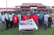 Officials of the GPF, and NYPD cricket team stand for a photo