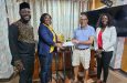 LGC Secretary receives the sponsorship cheque from a House of Majesty representative alongside Pope Emanuel London and Eureka Giddings