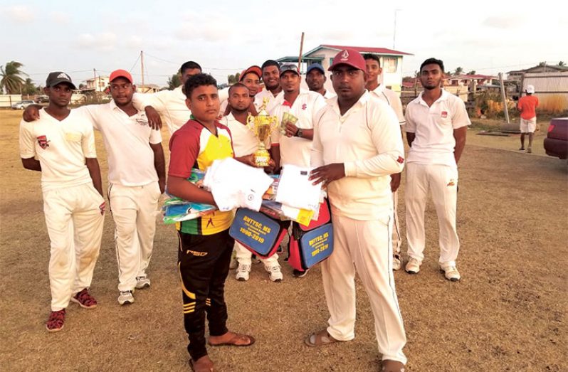 Assistant Secretary/CEO Simon Naidu hands over donation to the Cotton Tree Die Hard Cricket Club.