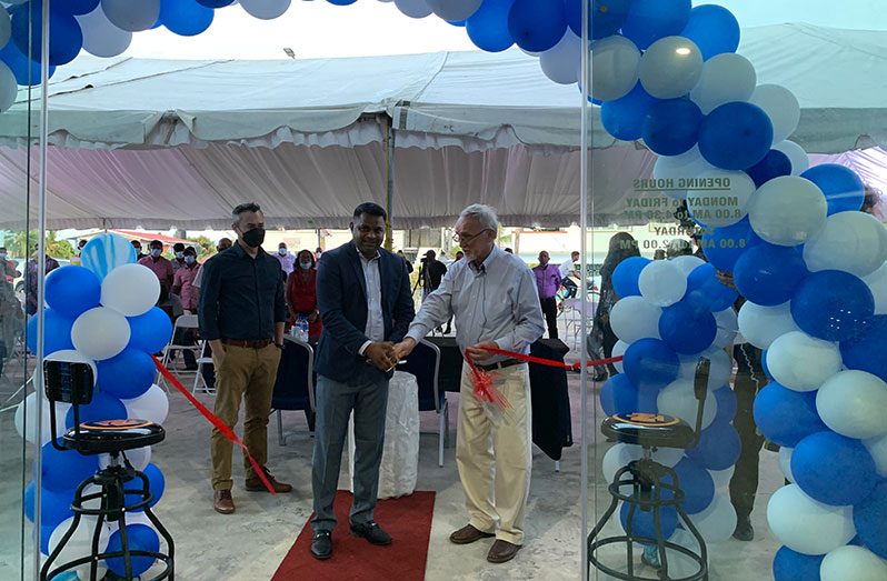 Minister within the Ministry of Public Works, Deodat Indar, and FARMSUP Managing Director, Renger Van Dijk, cut the ribbon to officially open the company’s Berbice branch  