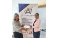 Guyana Women in Chess Community representative collects sponsorship from Pinnacle Business Services Inc. for the upcoming tournament