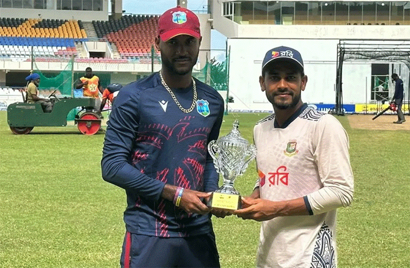 West Indies captain Kraigg Brathwaite (left) and Bangladesh captain, Mehidy Hasan Miraz pose with the winner’s trophy. (Photo courtesy CWI Media)