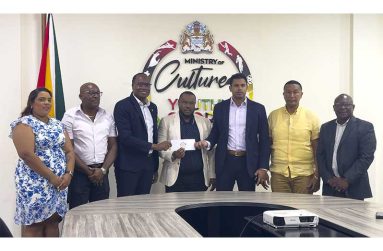 Ministers of MCYS presenting the cheque to Petra’s Troy Mendonca (Japhet Savory photo)