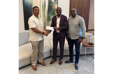 Monty Lewis presents $500,000 to Kashif Muhammad, in the presence of co-founder Aubrey ‘Shanghai’ Major, as a prize for the K&S tournament’s leading goalscorer
