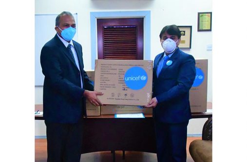 UNICEF Country Representative for Guyana and Suriname, Irfan Akhtar, in a symbolic handing over of the items to Health Minister, Dr Frank Anthony at the minister’s office on Brickdam