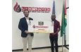 Executive Director of Lindsayca Integrated Energy Solution Group Mr. Grean Fuentes (left) hands over sponsorship to the manager of RS Sports Mr. Seetaram