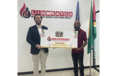 Executive Director of Lindsayca Integrated Energy Solution Group Mr. Grean Fuentes (left) hands over sponsorship to the manager of RS Sports Mr. Seetaram