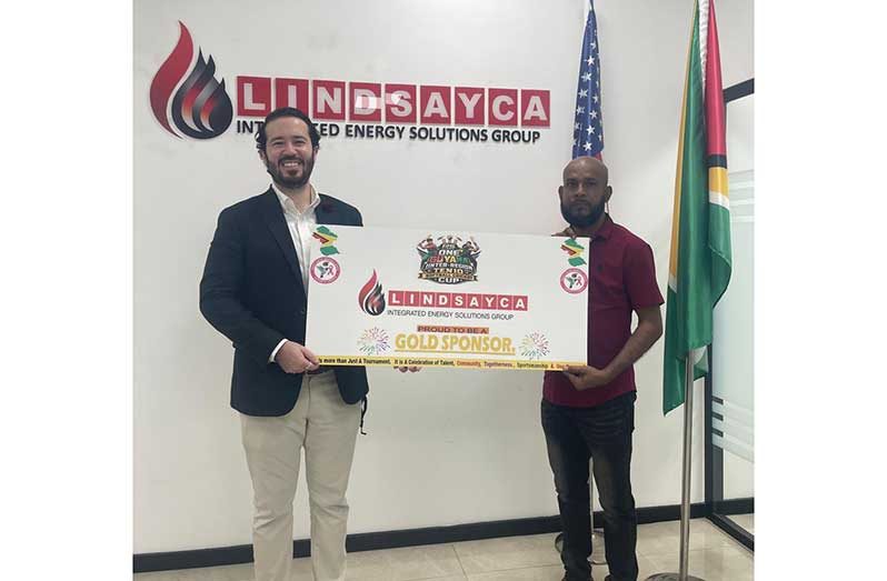 Executive Director of Lindsayca Integrated Energy Solution Group Mr. Grean Fuentes (left) hands over sponsorship to the manager of RS Sports Mr. Seetaram