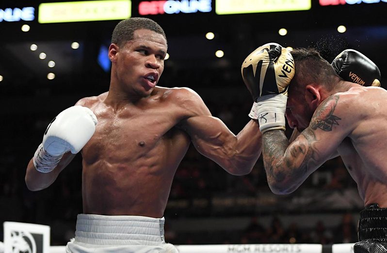 Devin Haney left) and Jorge Linares battle during their WBC lightweight title fight at Michelob ULTRA Arena.