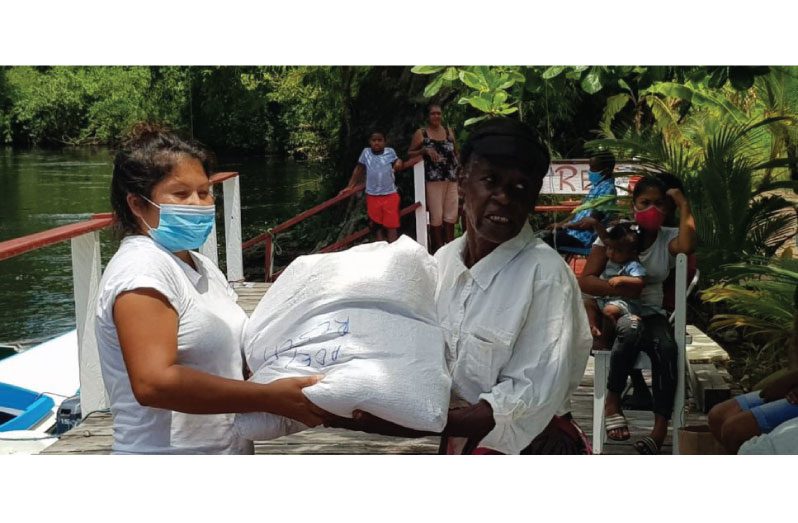 The happy faces of some family members who received hampers distributed at the resort’s boat landing