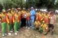 Mahendra “Anil” Hardyal, Managing Director of Regal Stationery & Computer Centre and owner of Regal softball teams, hands over the plaque and cash to Throy Kippins in the presence of Ravi Etwaroo and members of the Regal Legends team.