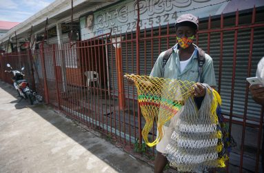 Raul Harmon with his handmade polythene bags. – Elvin Croker Photo.
