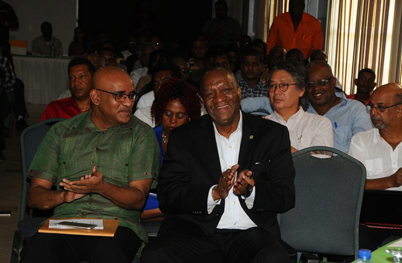 Minister of State Joseph Harmon (right) and Opposition Leader Bharrat Jagdeo share a light moment during the conference (Adrian Narine photo)