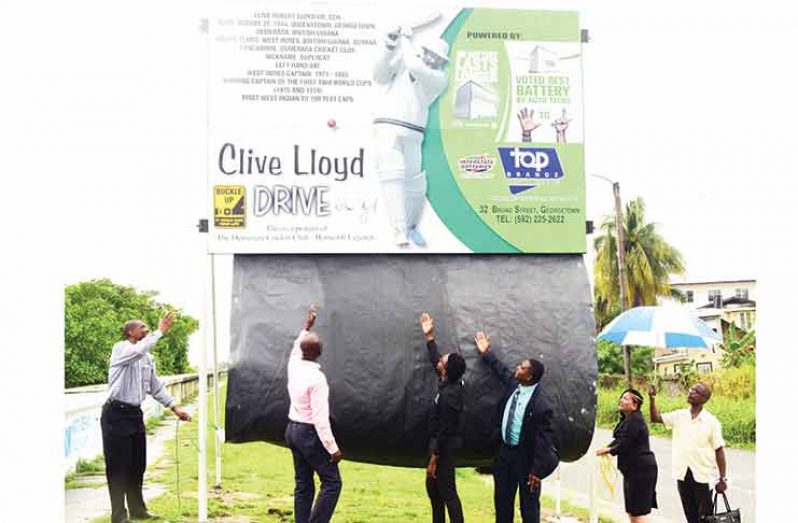 1.	President of the DCC, Roger Harper (left); Mayor of Georgetown, Patricia Chase-Green (right); along with Reginald Brotherson and representatives of the Ministry of Public Infrastructure and Top Brandz, unveiled one of the signboards. (Adrian Narine photos)