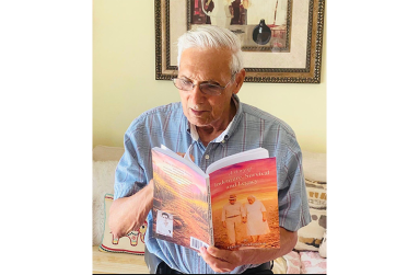Guyanese-American author Harry Rickheeram displays his latest book, A Story of Indenture, Survival and Legacy, which traces his family’s journey from India to British Guiana.