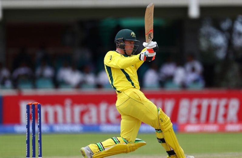 Mackenzie Harvey hits out during his innings of 63. (ICC via Getty Images)