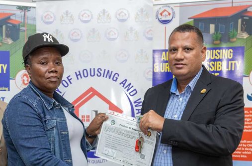 Minister of Housing and Water, Collin Croal, officially hands over the keys and electrical certificates during a brief ceremony at the Ministry’s headquarters