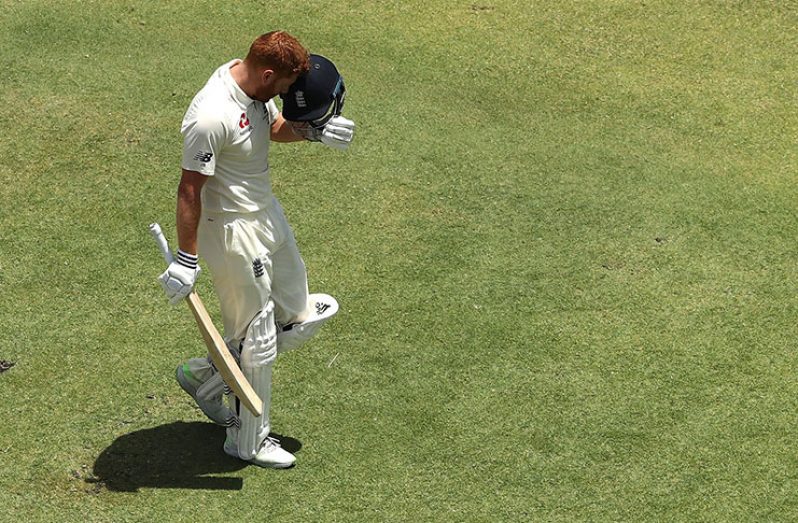 Head-on: Bairstow celebrated the landmark by nuzzling his helmet. (Getty Images)